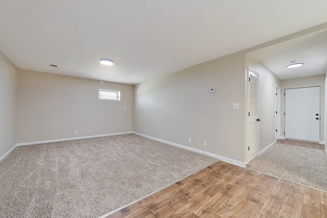 an empty room with a empty space and window