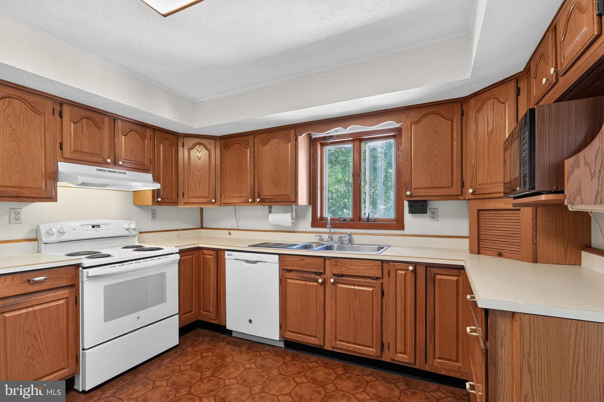 1720 Upper State Road Doylestown, PA 18901 - Photo 5 of 30 EIK w Wood Cabinets & Casement Window above Sink