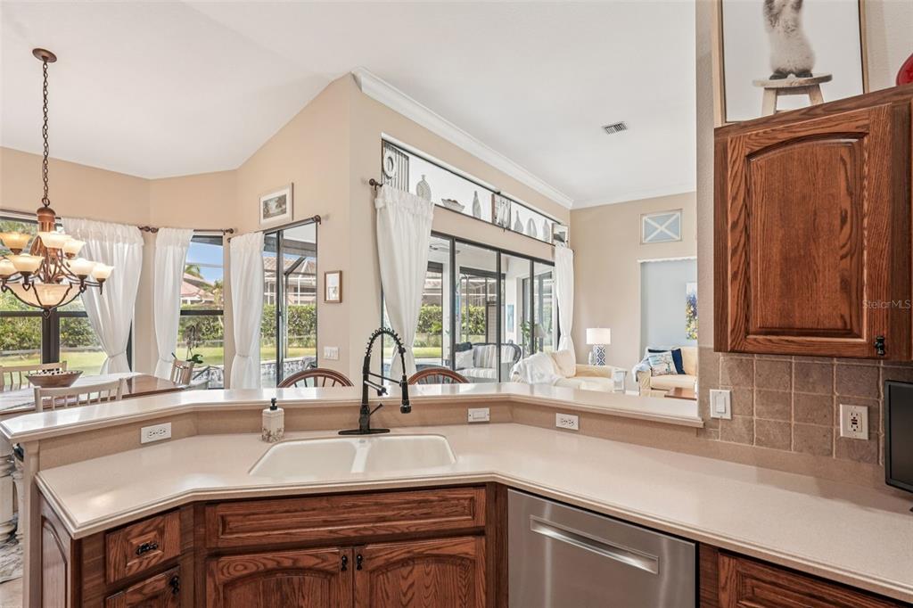 626 May Apple Way Venice, FL 34293 - Photo 14 of 60 a kitchen with a sink and a window
