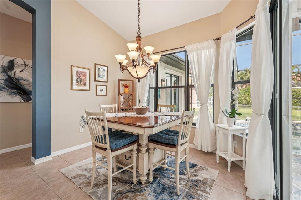 626 May Apple Way Venice, FL 34293 - Photo 15 of 60 a view of a dining room with furniture window and outside view