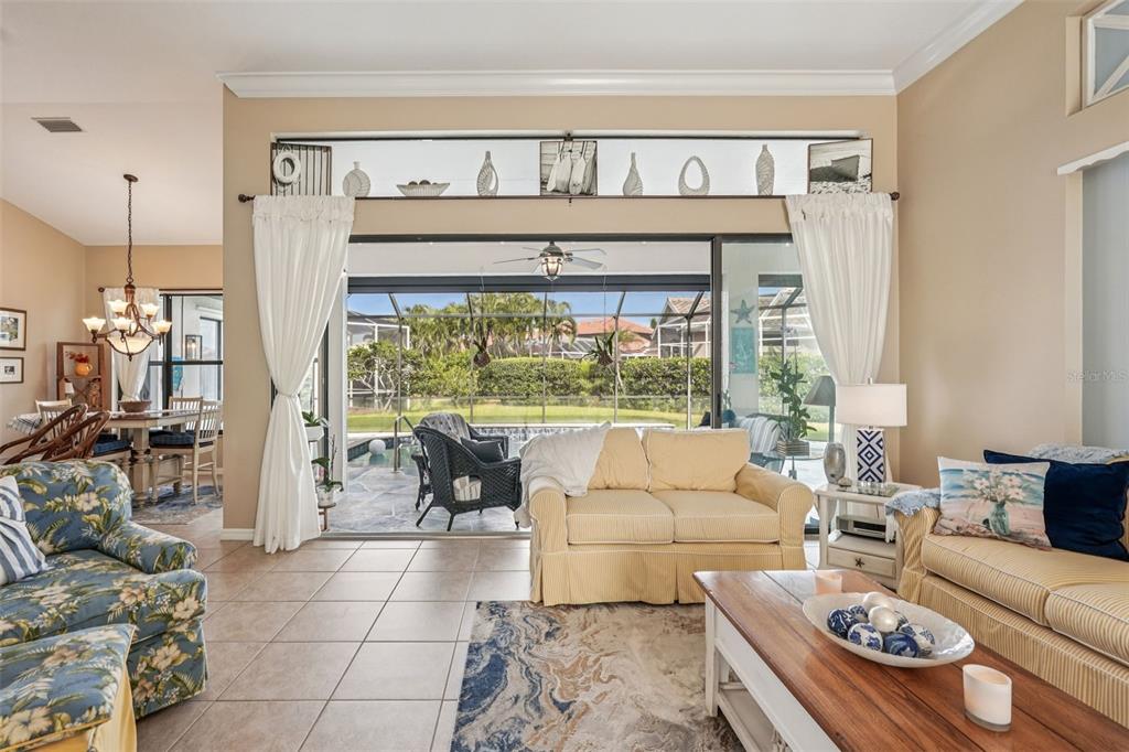 626 May Apple Way Venice, FL 34293 - Photo 16 of 60 a living room with furniture and a large window