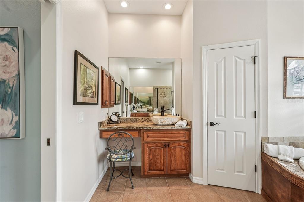 626 May Apple Way Venice, FL 34293 - Photo 25 of 60 a room with a sink and a mirror