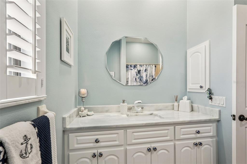 626 May Apple Way Venice, FL 34293 - Photo 30 of 60 a bathroom with a sink vanity and a mirror
