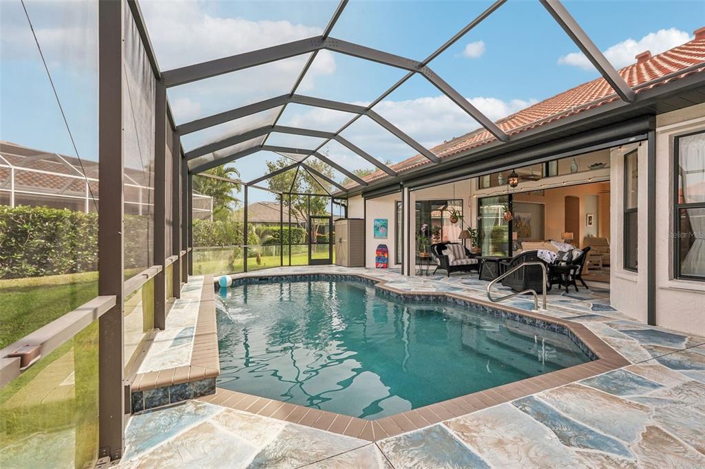 626 May Apple Way Venice, FL 34293 - Photo 3 of 60 a swimming pool with outdoor seating and yard