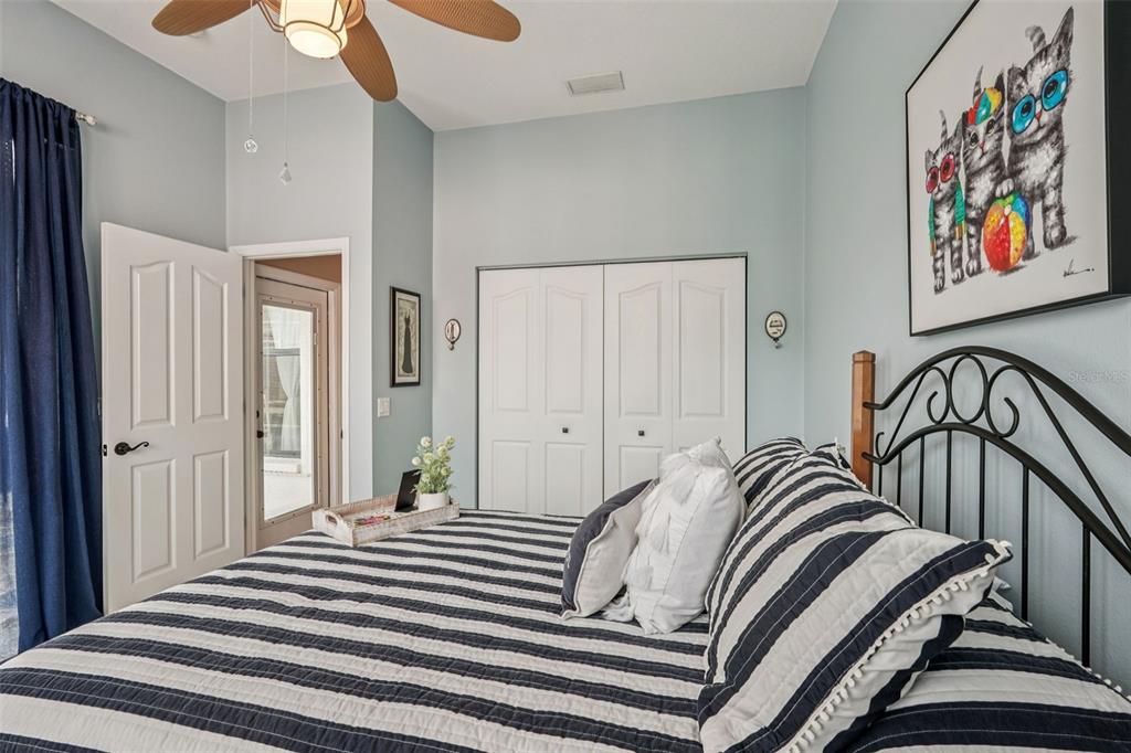 626 May Apple Way Venice, FL 34293 - Photo 34 of 60 a bedroom with two beds and a painting on the wall