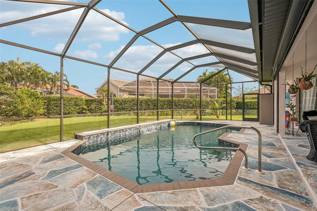 626 May Apple Way Venice, FL 34293 - Photo 38 of 60 a building with glass top table and chairs