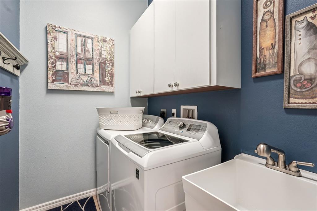 626 May Apple Way Venice, FL 34293 - Photo 39 of 60 a utility room with dryer and washer