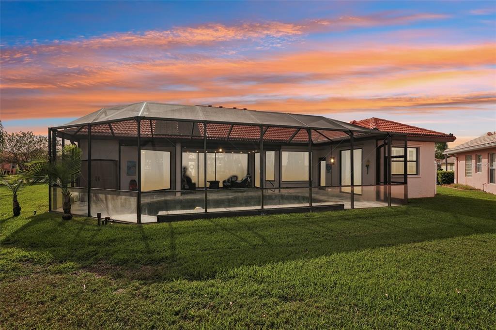 626 May Apple Way Venice, FL 34293 - Photo 40 of 60 a backyard of a house with lots of green space