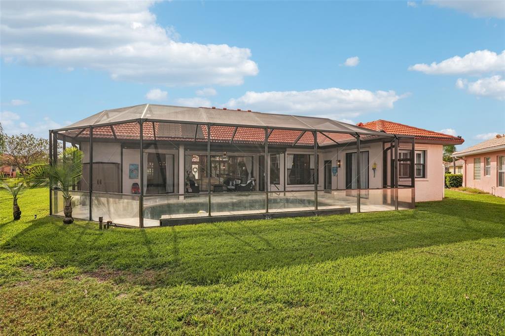 626 May Apple Way Venice, FL 34293 - Photo 41 of 60 a view of a house with a backyard