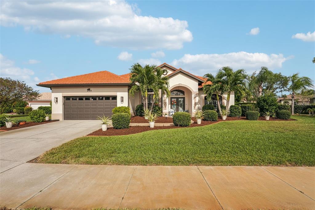 626 May Apple Way Venice, FL 34293 - Photo 45 of 60 a front view of a house with a yard