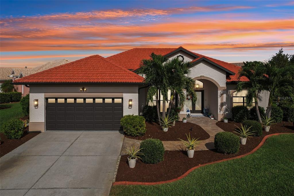 626 May Apple Way Venice, FL 34293 - Photo 46 of 60 a front view of a house with garden