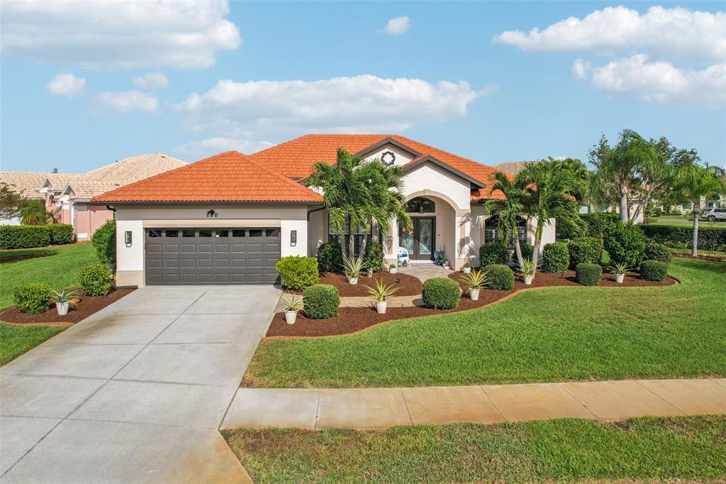 626 May Apple Way Venice, FL 34293 - Photo 48 of 60 a front view of a house with a yard and garage