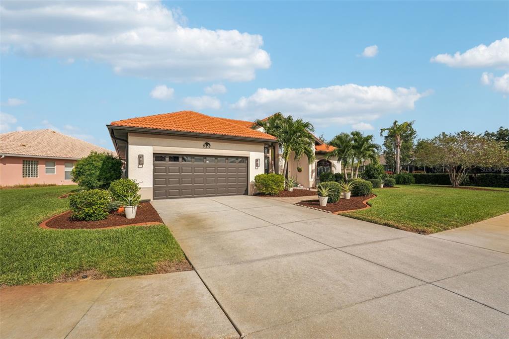 626 May Apple Way Venice, FL 34293 - Photo 49 of 60 a front view of house with yard and green space