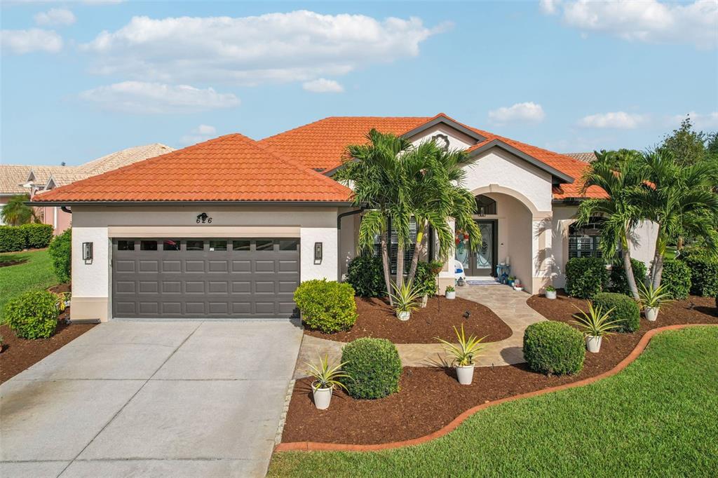 626 May Apple Way Venice, FL 34293 - Photo 50 of 60 a front view of a house with garden