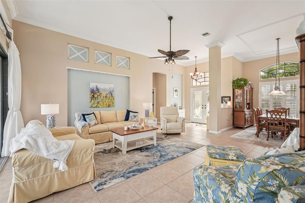 626 May Apple Way Venice, FL 34293 - Photo 5 of 60 a living room with furniture and wooden floor