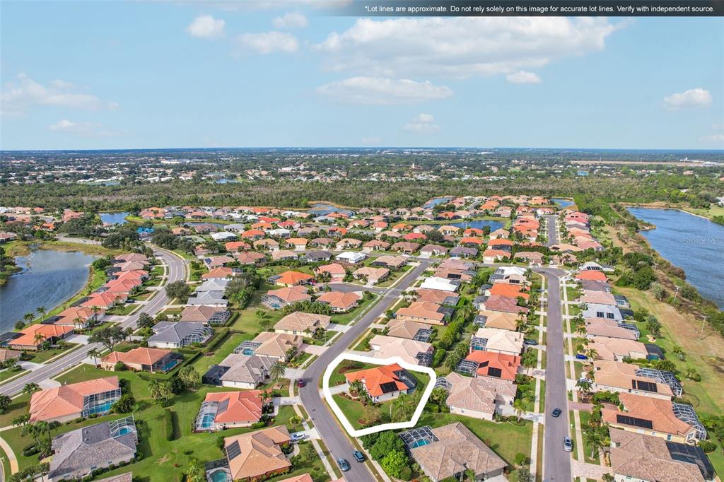 626 May Apple Way Venice, FL 34293 - Photo 60 of 60 an aerial view of residential building with parking space