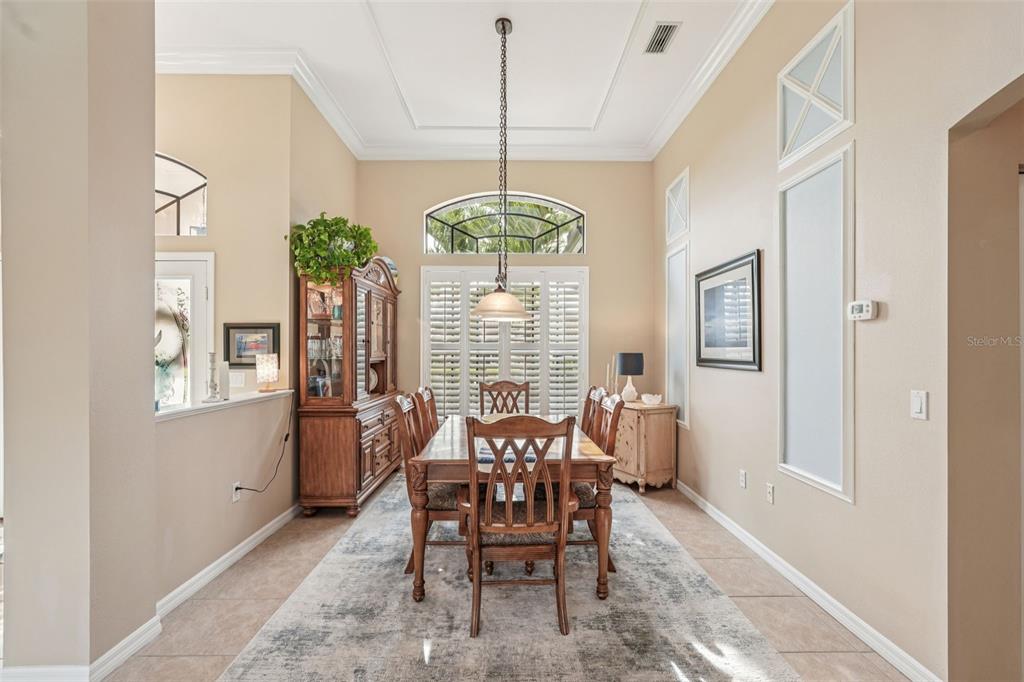 626 May Apple Way Venice, FL 34293 - Photo 10 of 60 a dining room with furniture and window