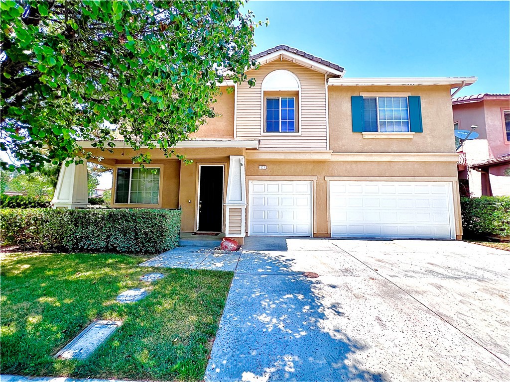 11231 Springway Court Riverside, CA 92505 - Photo 1 of 1 a front view of a house with a yard and garage