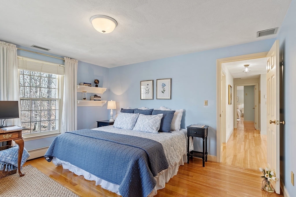 24 Greybirch Road Andover, MA 01810 - Photo 28 of 42 a bedroom with a bed and a flat screen tv
