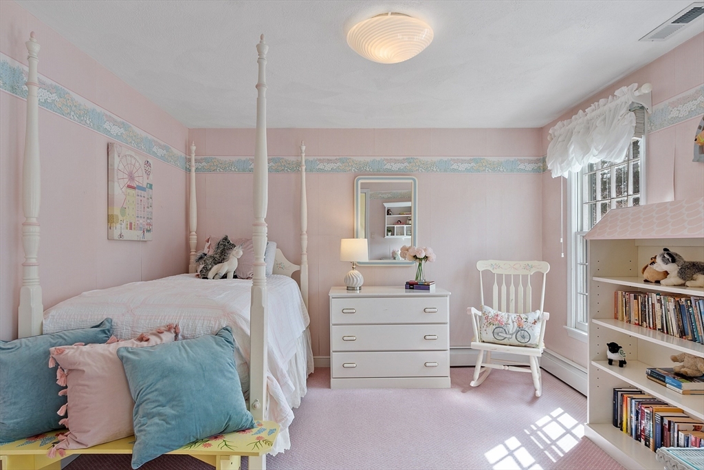 24 Greybirch Road Andover, MA 01810 - Photo 30 of 42 a bedroom with furniture and a book shelf