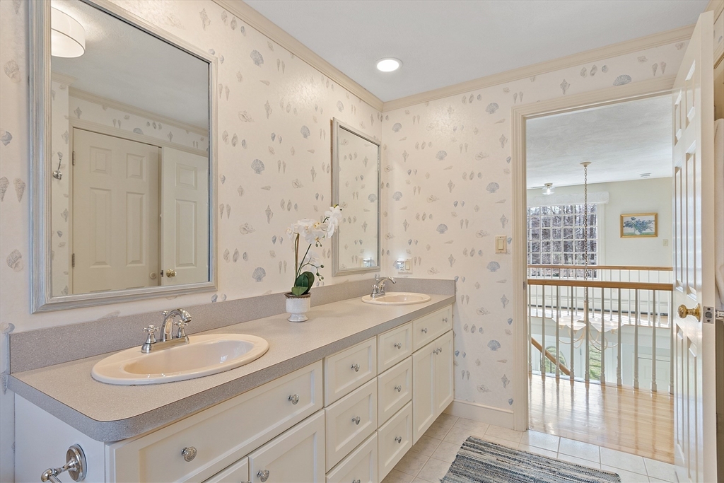 24 Greybirch Road Andover, MA 01810 - Photo 31 of 42 a bathroom with double sink and a mirror