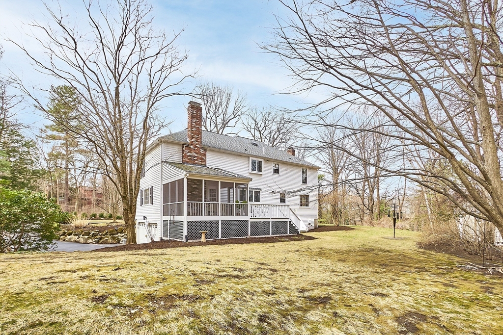 24 Greybirch Road Andover, MA 01810 - Photo 36 of 42 a view of a large white house with a large tree