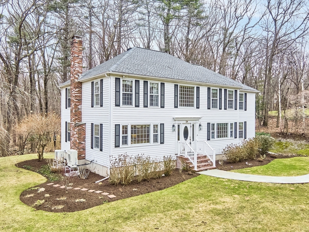 24 Greybirch Road Andover, MA 01810 - Photo 38 of 42 a front view of a house with yard and green space