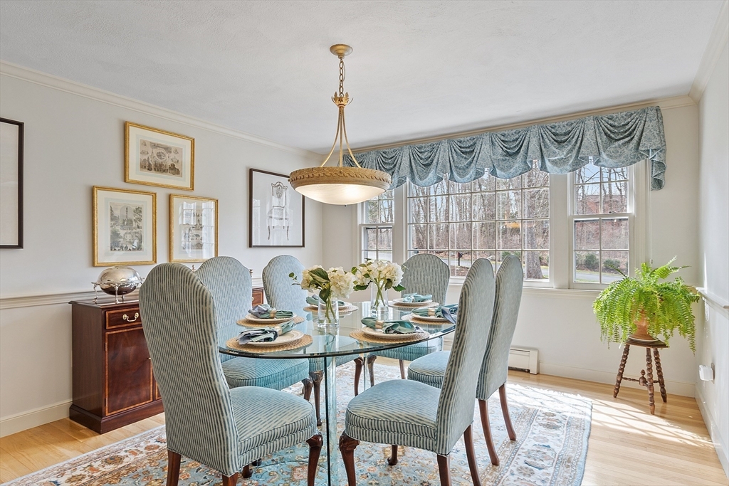 24 Greybirch Road Andover, MA 01810 - Photo 10 of 42 a dining room with furniture a chandelier and wooden floor