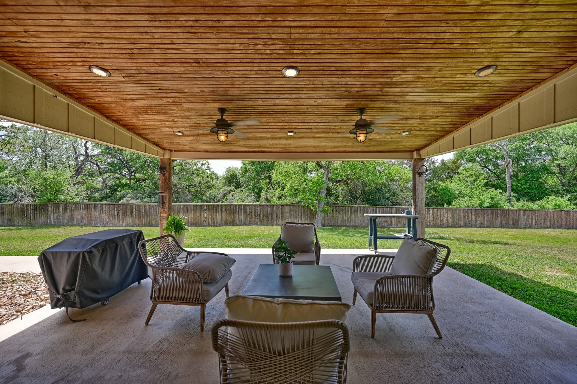 2245 Strangmeier Road Brenham, TX 77833 - Photo 37 of 40 The large, attached patio overlooks the expansive backyard