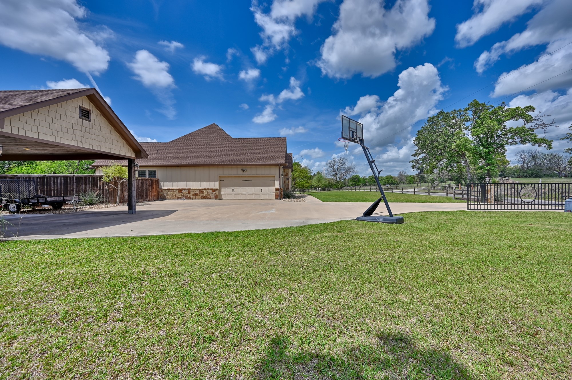 2245 Strangmeier Road Brenham, TX 77833 - Photo 9 of 40 Attached Garage, extra paved parking and carport.