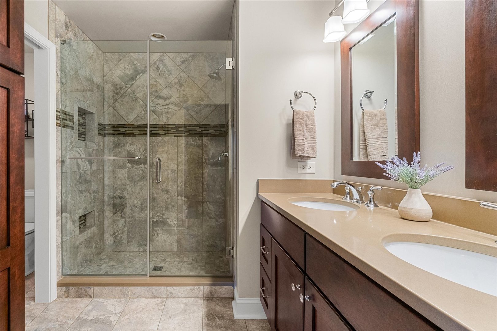 3819 Capri Court Naperville, IL 60564 - Photo 18 of 37 a bathroom with a granite countertop sink a mirror and shower