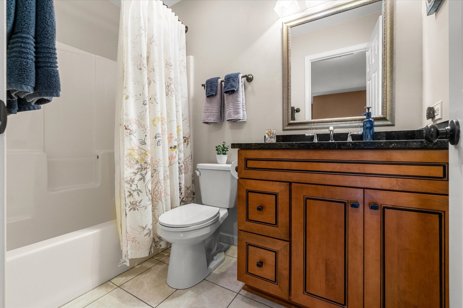 3819 Capri Court Naperville, IL 60564 - Photo 20 of 37 a bathroom with a toilet sink and mirror