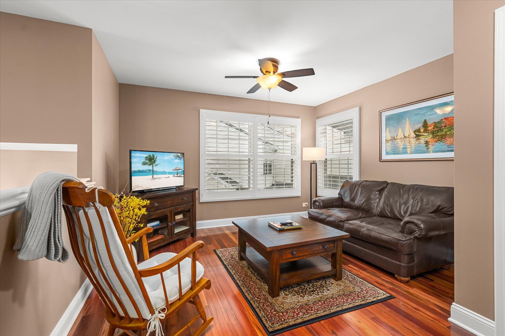 3819 Capri Court Naperville, IL 60564 - Photo 22 of 37 a living room with furniture a flat screen tv and a window