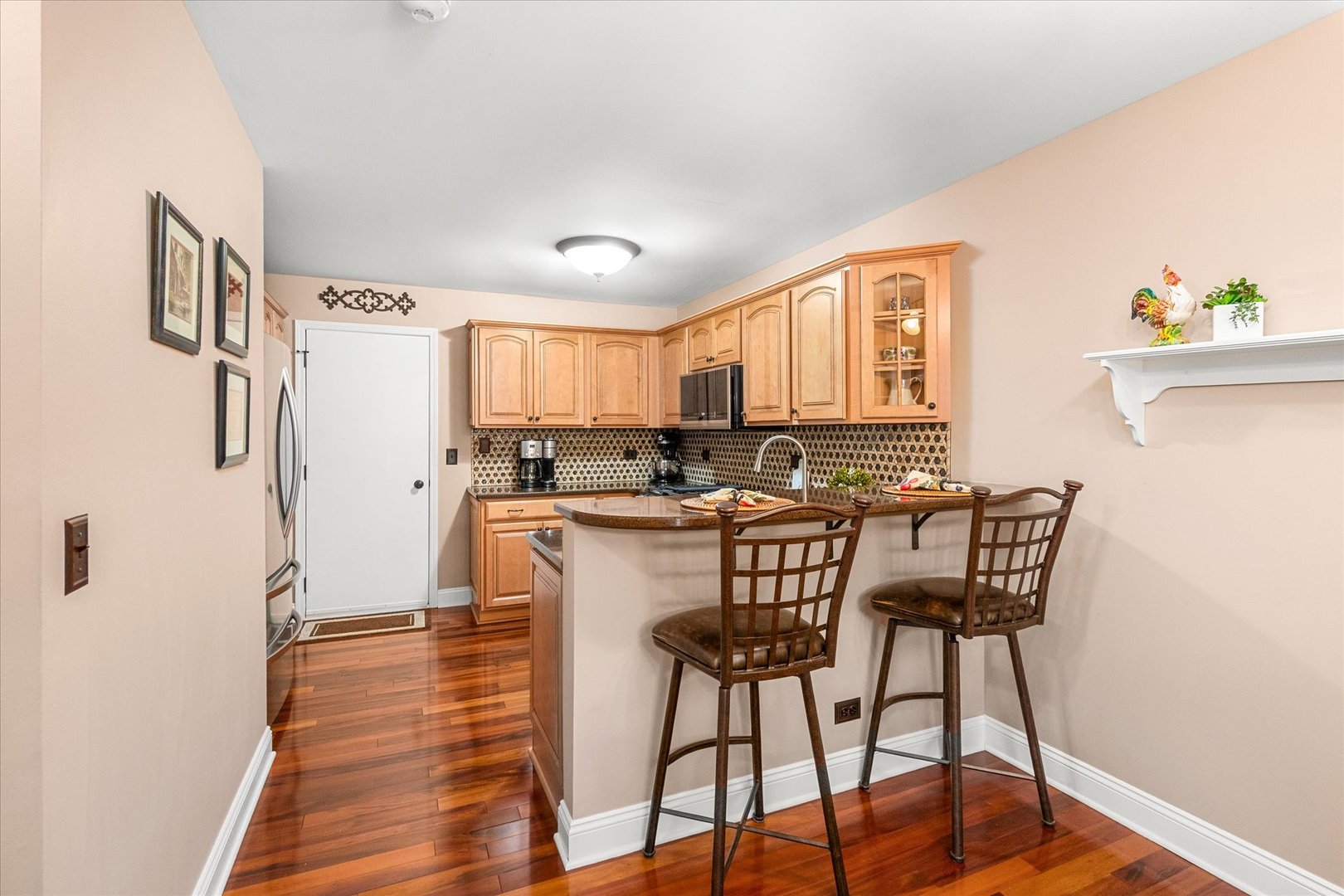 3819 Capri Court Naperville, IL 60564 - Photo 8 of 37 a view of a dining room with furniture and wooden floor