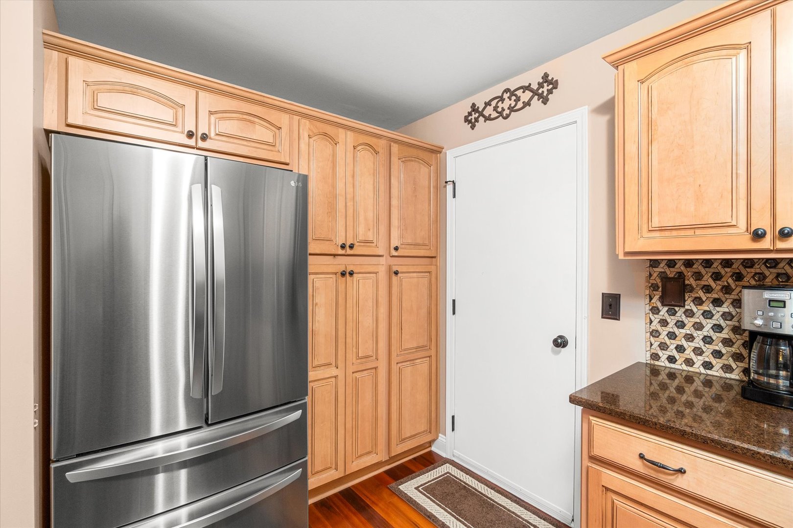 3819 Capri Court Naperville, IL 60564 - Photo 10 of 37 a kitchen with metallic refrigerator and cabinet
