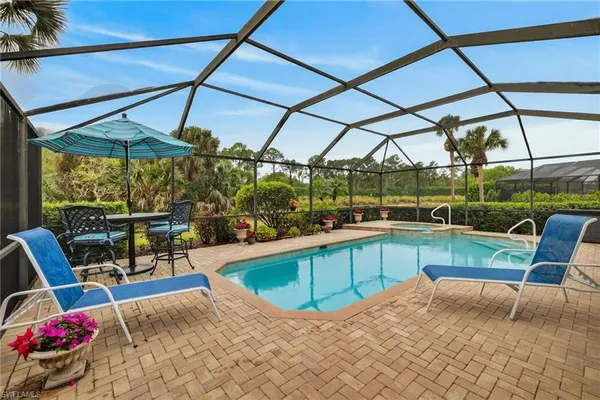 a view of a swimming pool with a patio