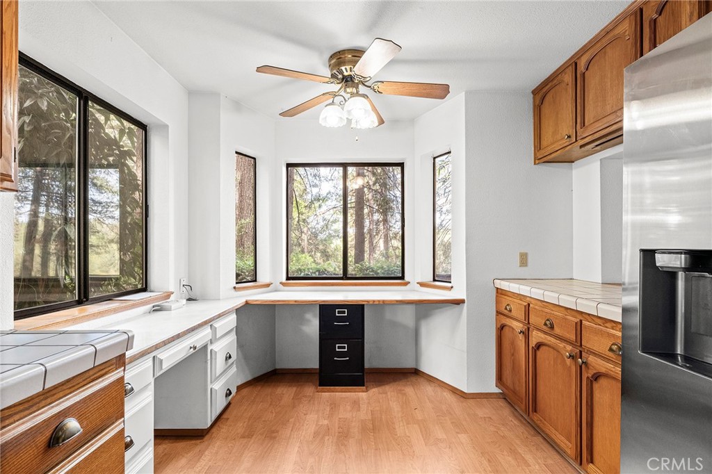 14243 Wycliff Way Magalia, CA 95954 - Photo 14 of 65 a kitchen with granite countertop a stove a sink and a refrigerator