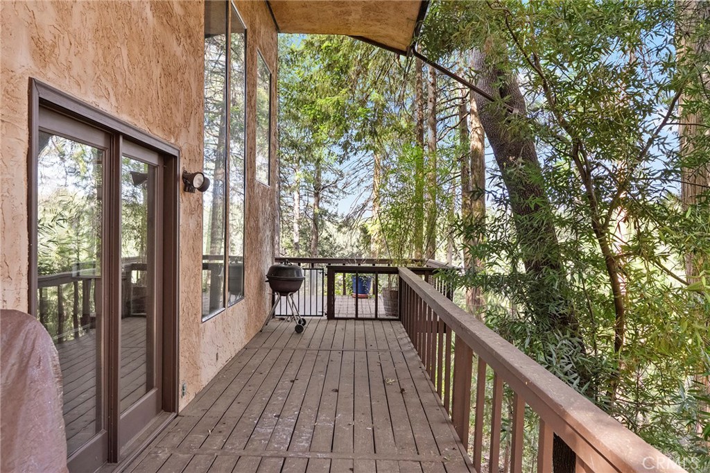 14243 Wycliff Way Magalia, CA 95954 - Photo 38 of 65 a view of balcony with wooden floor and fence