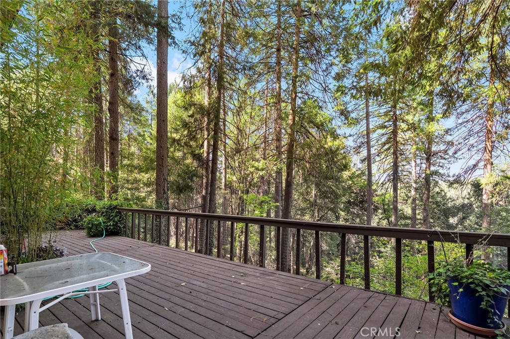 14243 Wycliff Way Magalia, CA 95954 - Photo 39 of 65 a view of balcony with wooden floor and outdoor seating