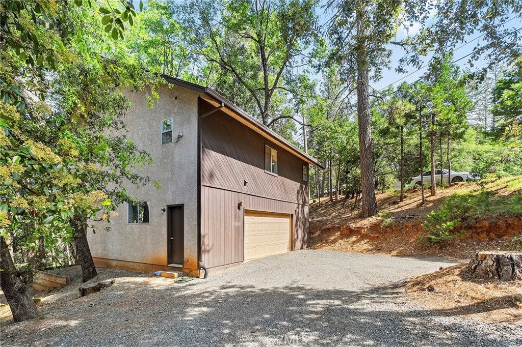 14243 Wycliff Way Magalia, CA 95954 - Photo 43 of 65 a house with a tree in front of it