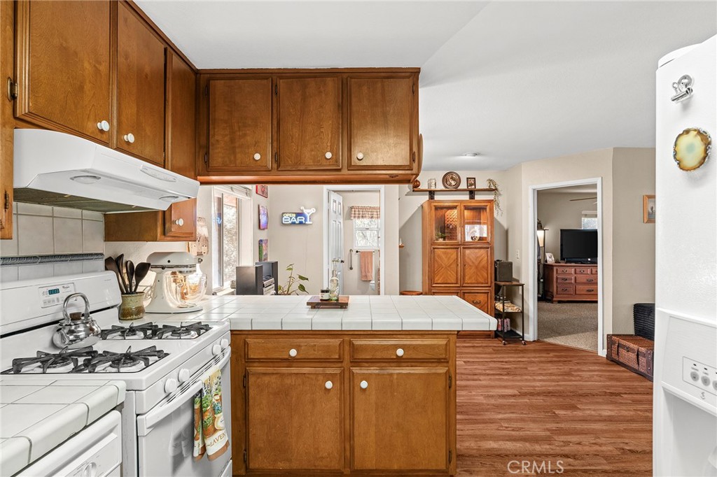 14243 Wycliff Way Magalia, CA 95954 - Photo 51 of 65 a kitchen with stainless steel appliances a sink stove and cabinets