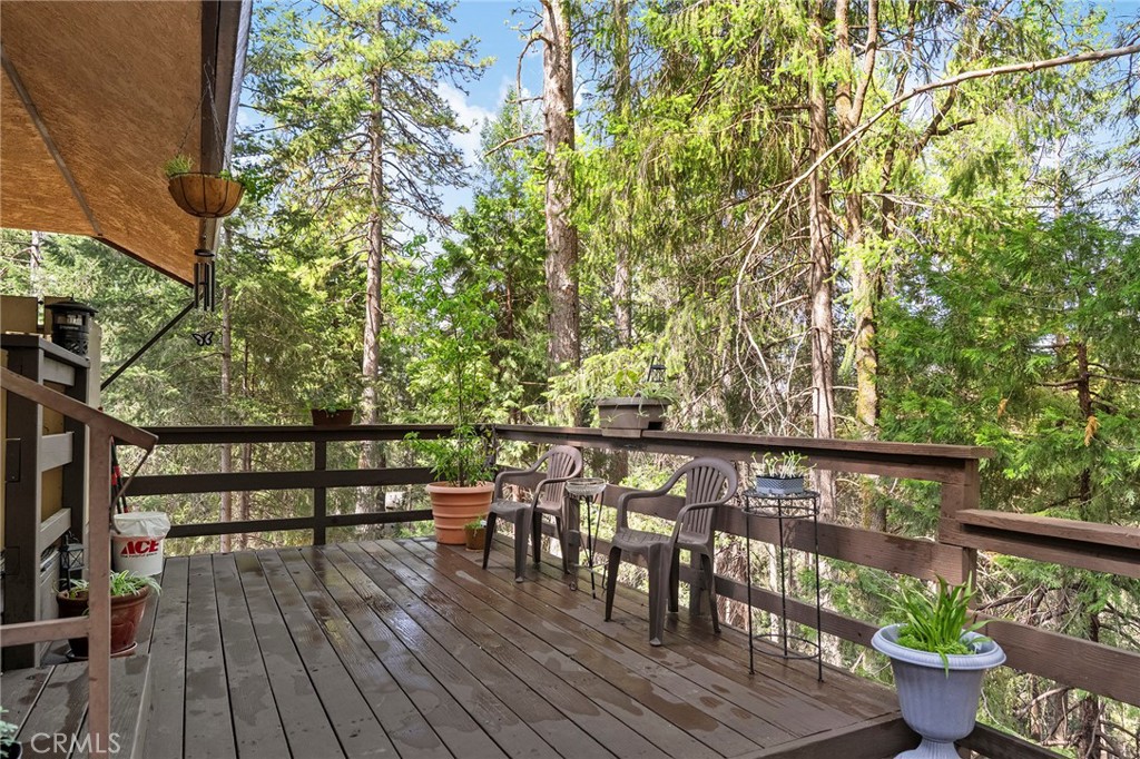 14243 Wycliff Way Magalia, CA 95954 - Photo 57 of 65 a view of a balcony with wooden floor and outdoor seating