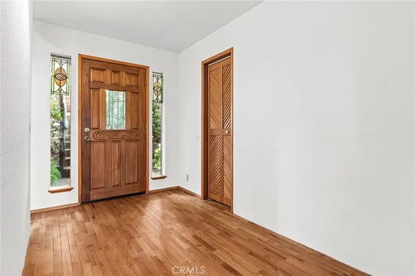 a view of balcony with wooden floor and fence