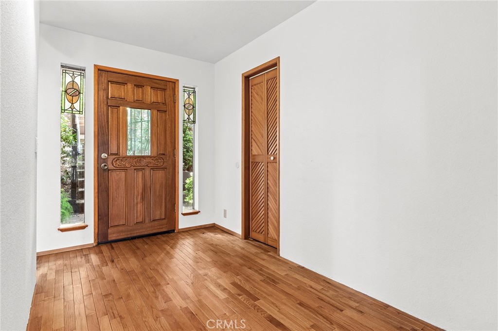 14243 Wycliff Way Magalia, CA 95954 - Photo 8 of 65 an empty room with wooden floor and windows