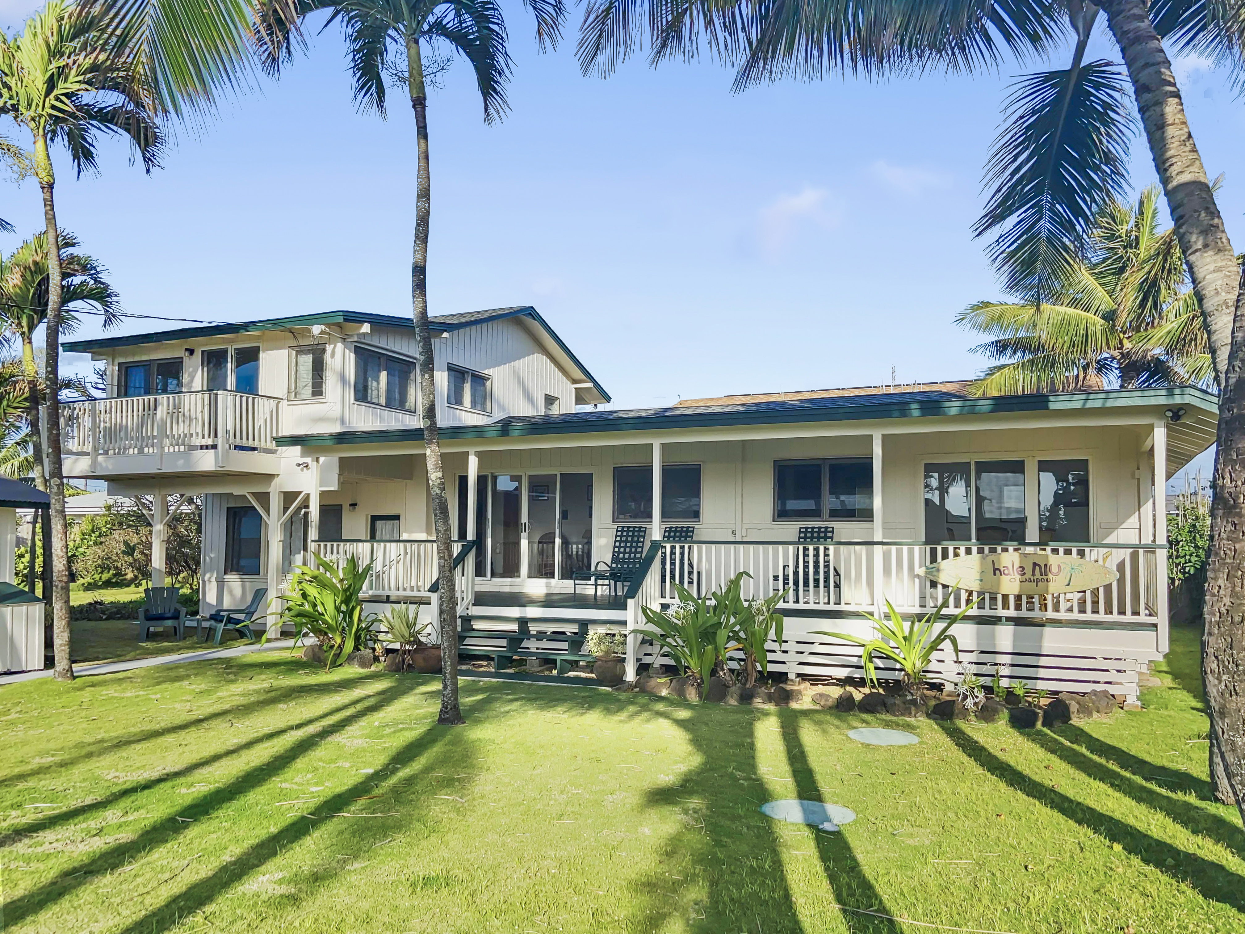 963 Niulani Road Kapaa, HI 96746 - Photo 3 of 27 a front view of house with yard and swimming pool