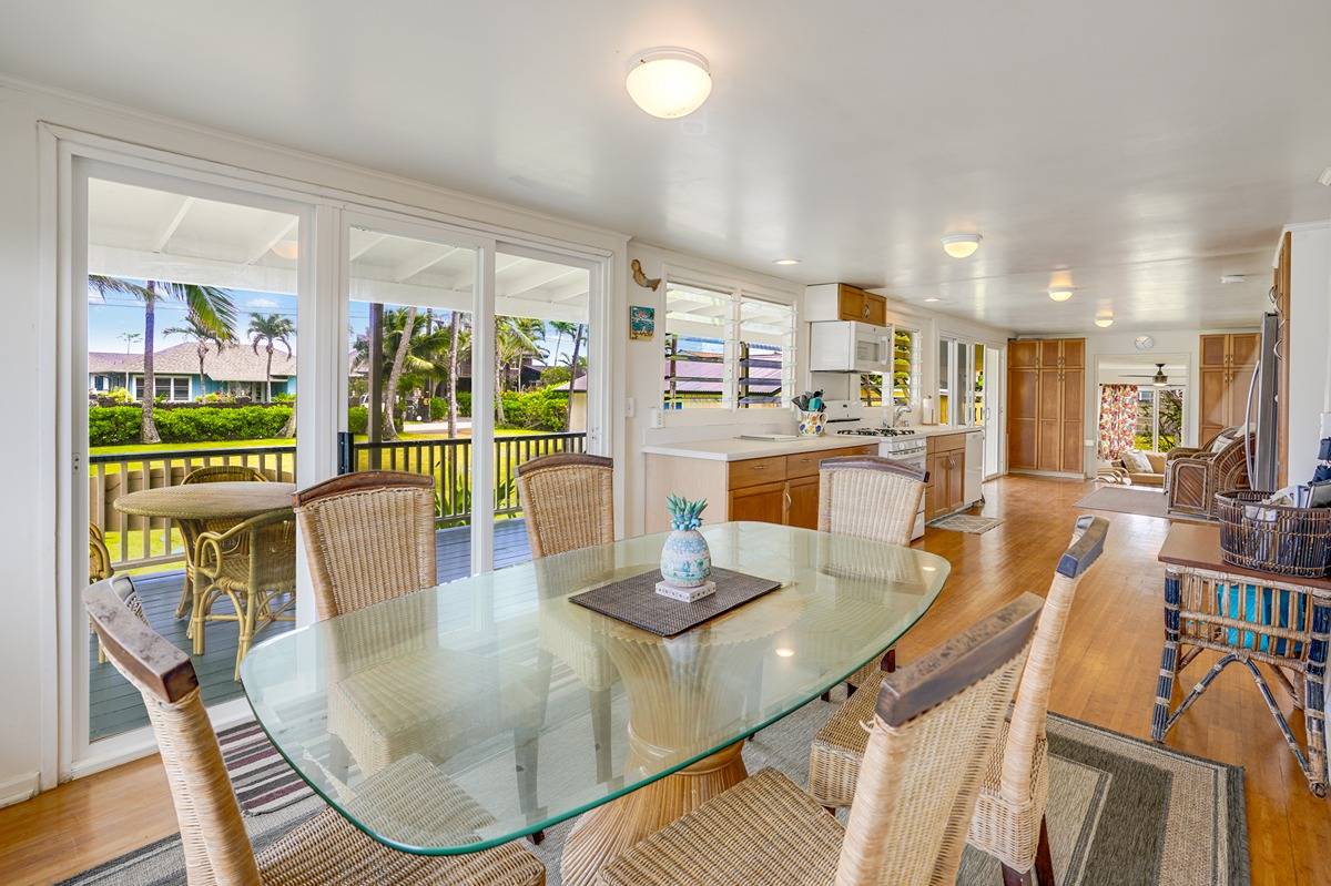 963 Niulani Road Kapaa, HI 96746 - Photo 6 of 27 a dining room with furniture a chandelier and wooden floor