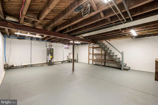 a view of an empty room with gym equipment