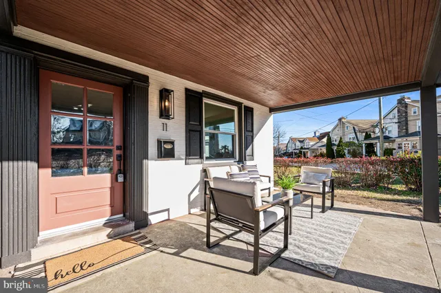 a building outdoor space with patio furniture and potted plants