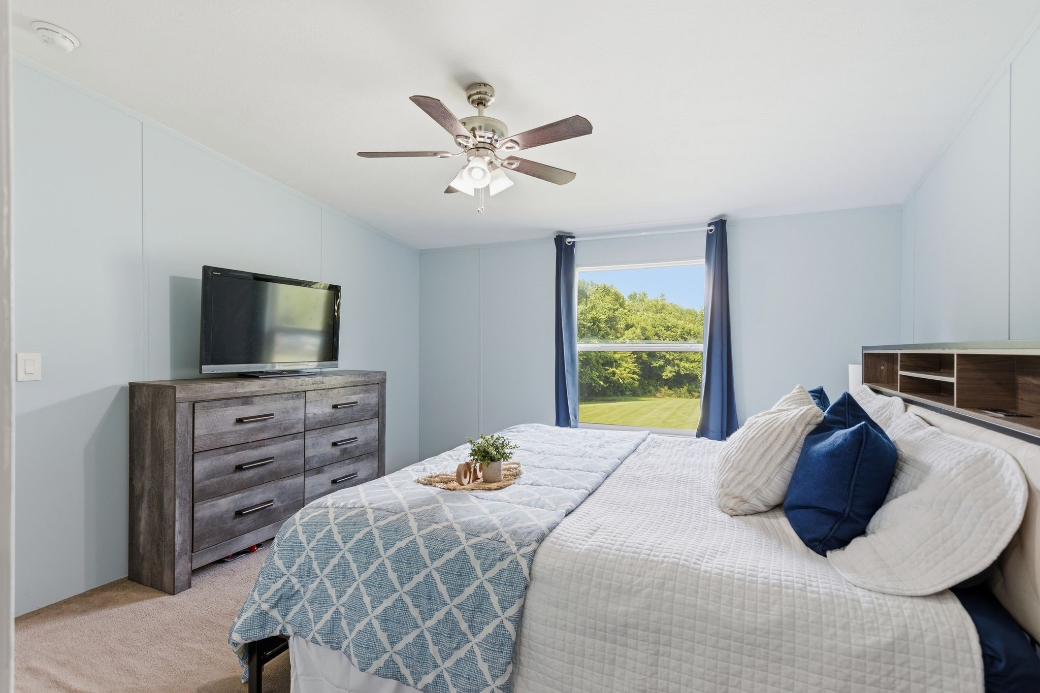 3204 Grizzly Road Culleoka, TN 38451 - Photo 11 of 25 a bedroom with a bed and a flat screen tv