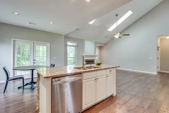 a bathroom with a sink a mirror and a shower